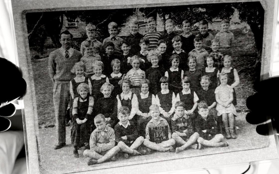 A blurry black and white school class photograph
