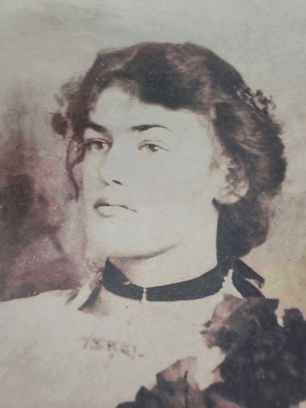 A silvered black and white portrait of a young woman